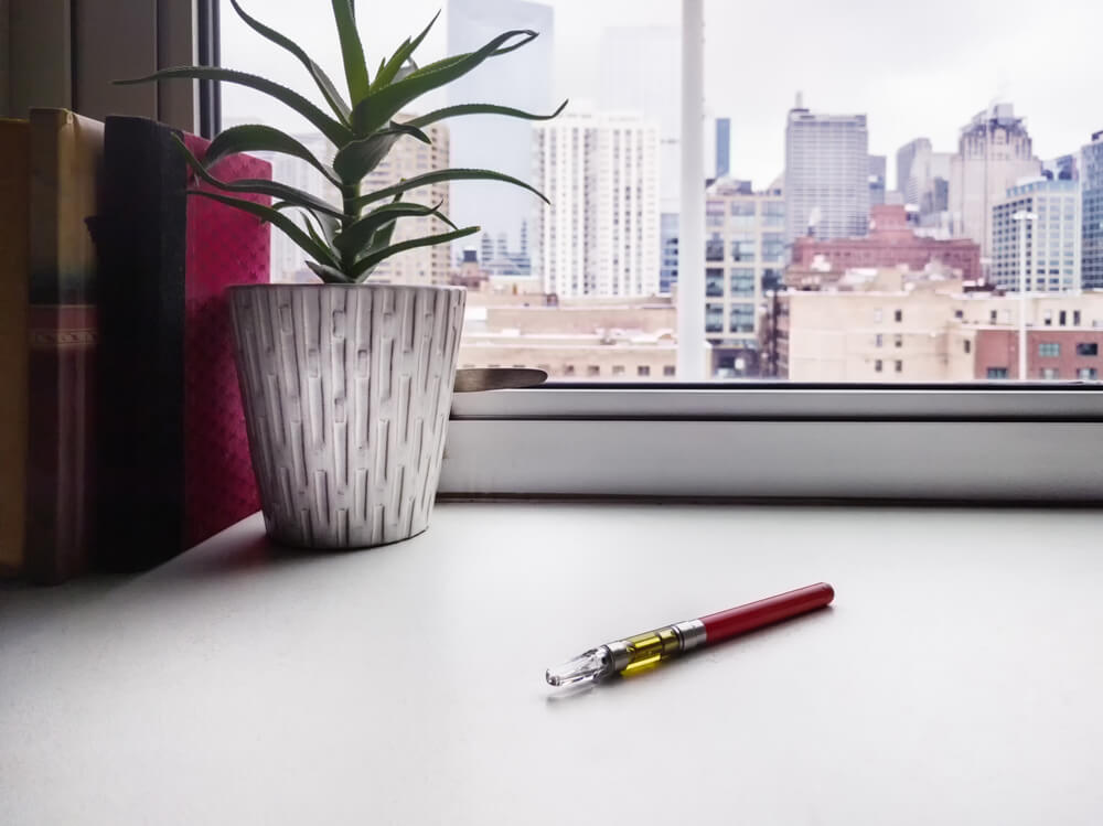 A vaporizer pen in a hotel room