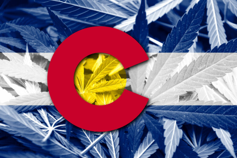 Colorado State Flag on cannabis background.