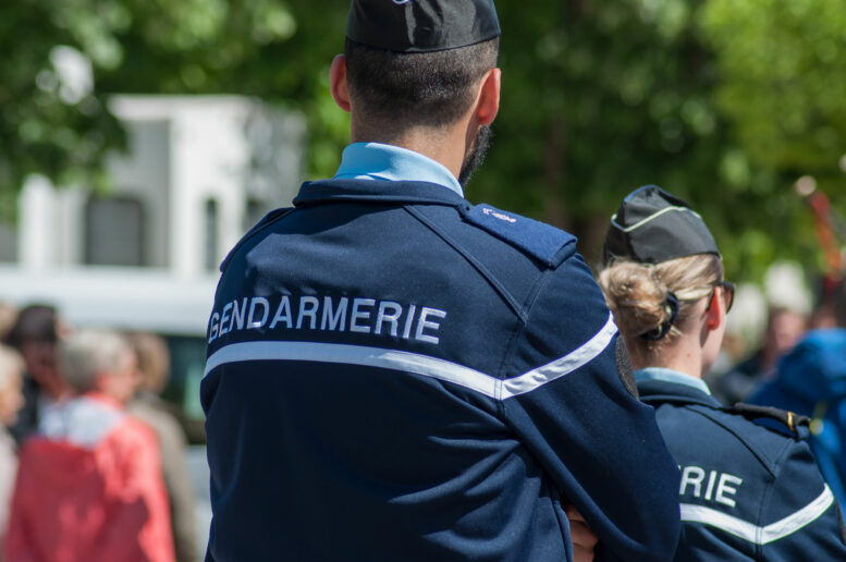 french gendarmerie patrol in lily of the valley party in the street