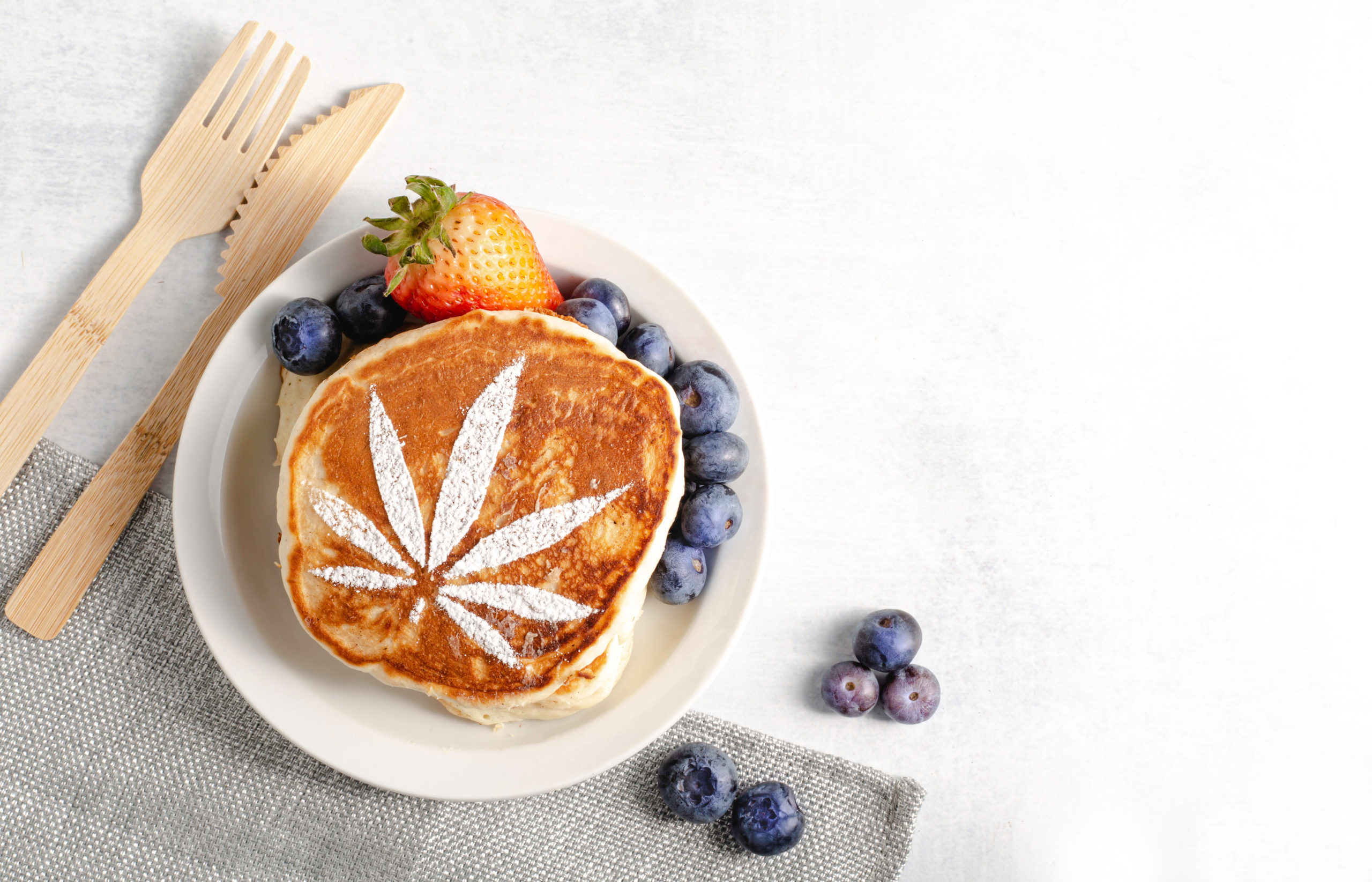 Cannabis,Powder,Over,Warm,Pancakes,With,Fresh,Blueberries,And,Strawberries